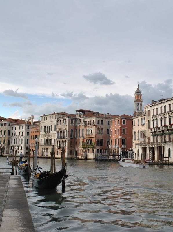 Traditional gondolas in Venice on the Grand Canal. Read your perfect itinerary for Europe in two months with tips for your European itinerary. #travel #europe #venice #italy