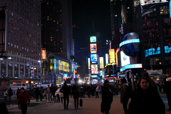 Times Square in winter. Get your free New York City packing list written by a New Yorker with what to wear in New York City in winter & what to pack for NYC.