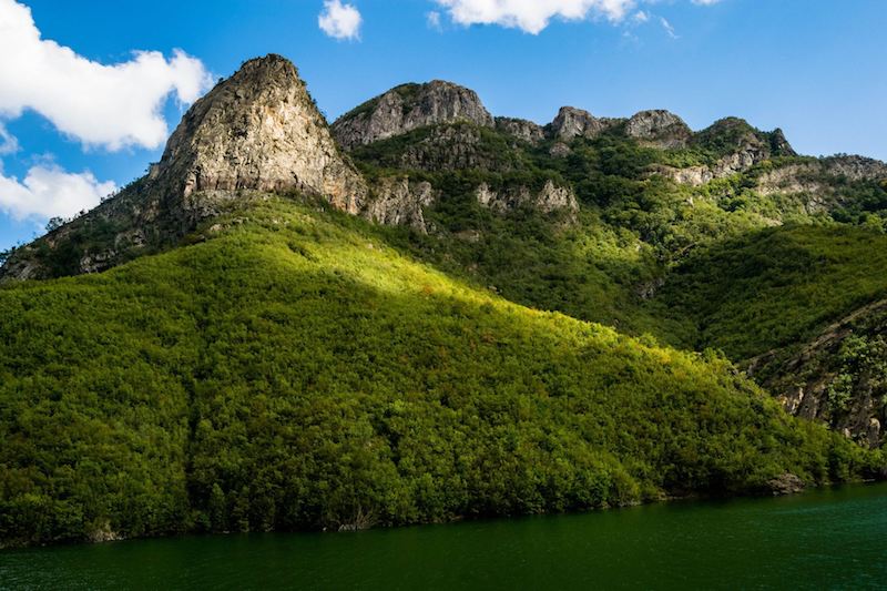 The ferry from Fierza is one of the best things to do in Albania. Read your perfect itinerary for Albania! #Albania #travel #Balkans