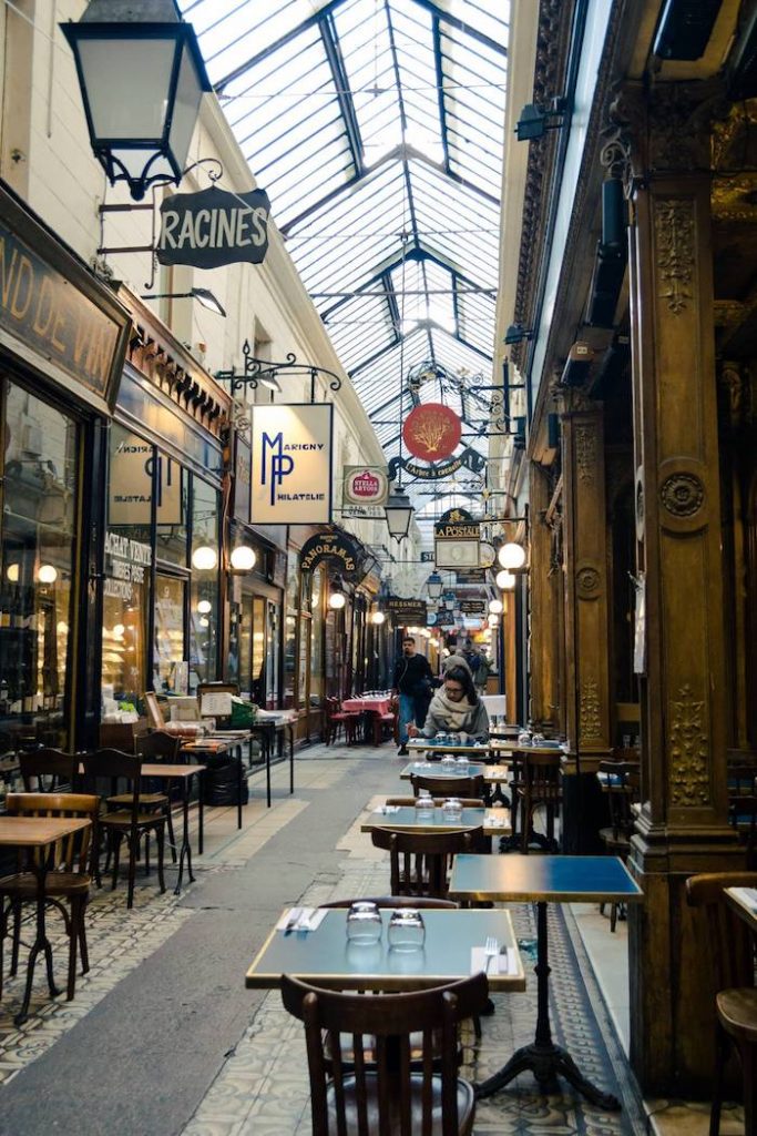 Photo of Passage des Panoramas, one of the most beautiful passages of Paris. Discover this passage on a self guided walking tour of Secret Paris! #Travel #France #Paris