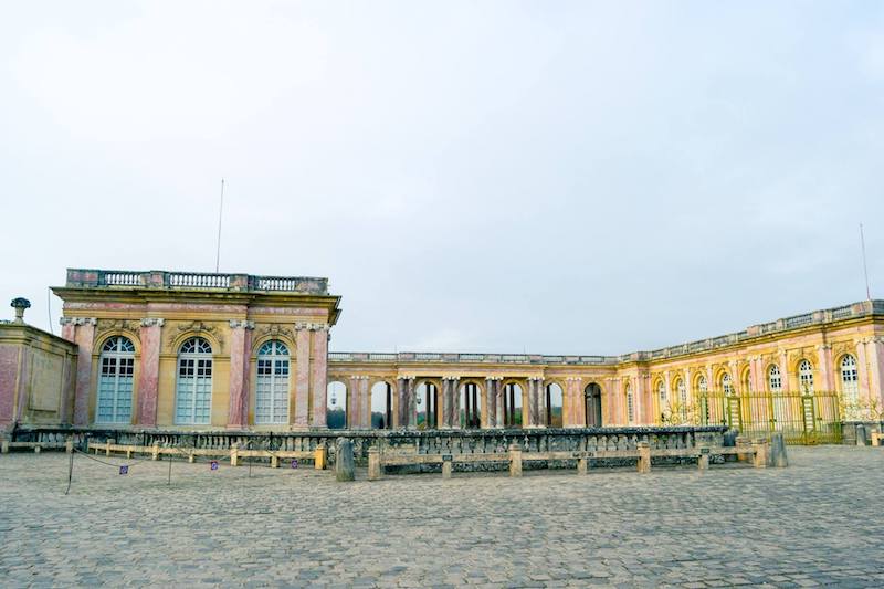 One of the beautiful buildings in Versailles. Read travel tips for visiting Versailles and the best months to visit Versailles. #travel #france