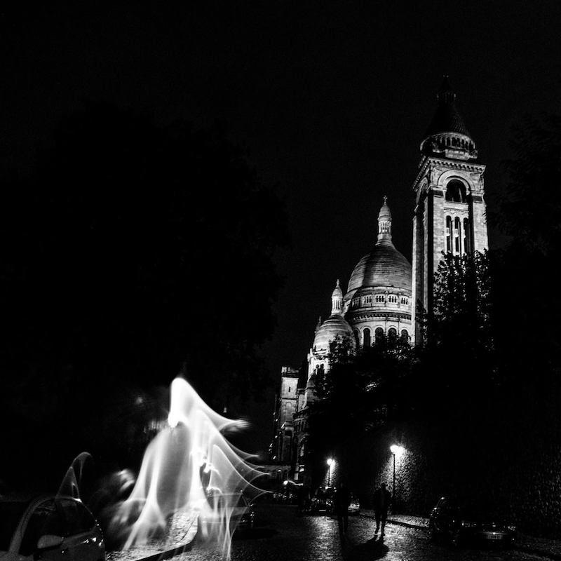 Sacre Coeur at night from the best viewpoint in Montmartre for the Sacre Coeur. Get your free self-guided walking tour of Montmartre. #travel #Paris #SacreCoeur #montmartre #France