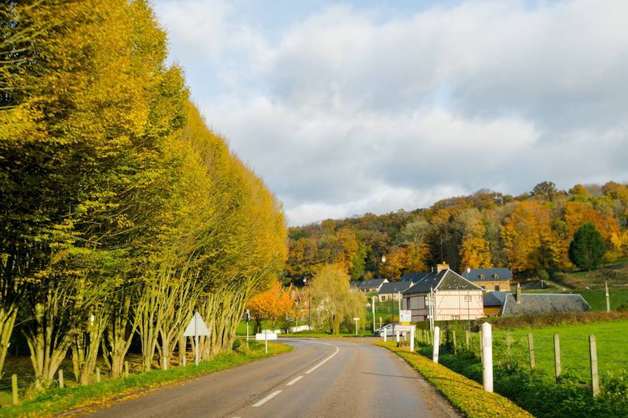 Beautiful houses in Normandy France. Read tips for saving money while visiting France with tips for traveling around France cheaply! #Normandy #France #travel