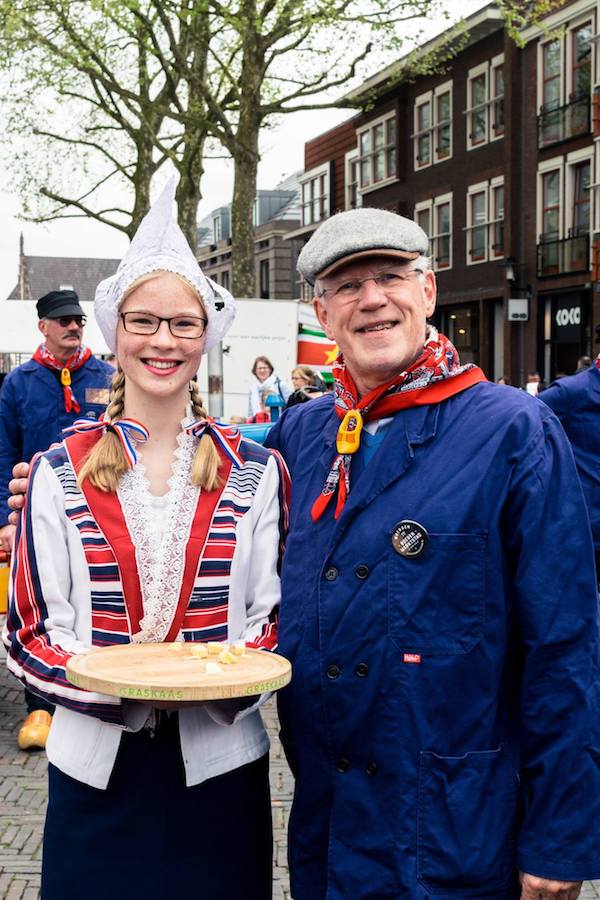 Farmer posing at the Woerden Kaasmarkt (Woerden Cheese market) in Woerden, the Netherlands. Read about visiting the last real Dutch cheese market. #travel #dutch #cheese #netherlands