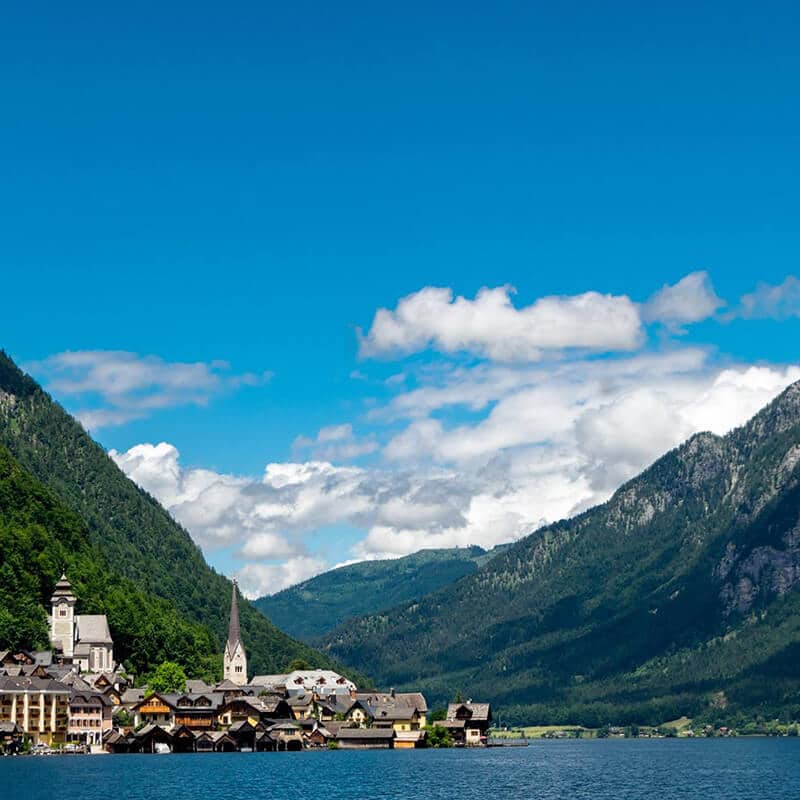 Beautiful view of Hallstatt from a distance.  This beautiful city in Austria is famous for its timber buildings! #travel #hallstatt #austria