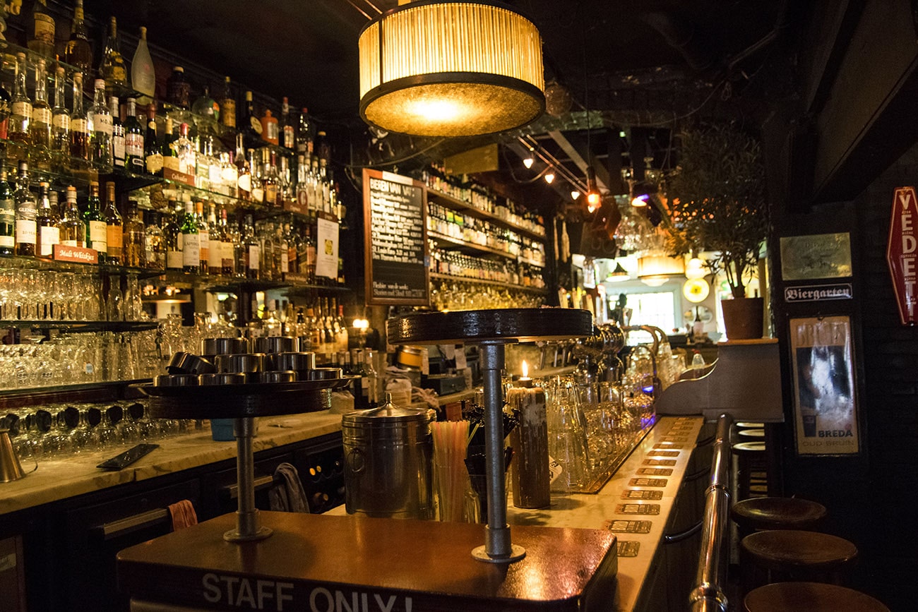 Interior of De Paas, one of the best beer bars in the Hague.  This historic brown bar is perfect for people looking for a gezellige cafe in The Hague. #travel #beer 