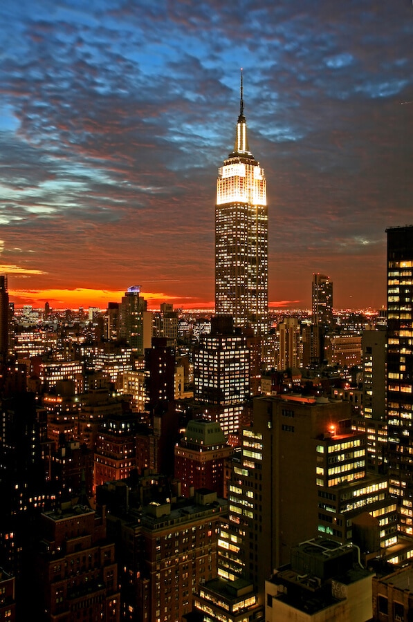 The Empire State Building at night, one of most famous attractions that you can see on this self-guided walking tour of New York City in one day! #NYC #travel