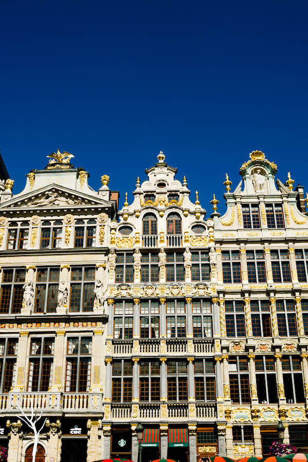 Beautiful buildings in Grote Markt (Grand Place) in Brussels. Read why you should visit this beautiful UNESCO recognized square in Brussels! #travel #brussels #belgium #europe