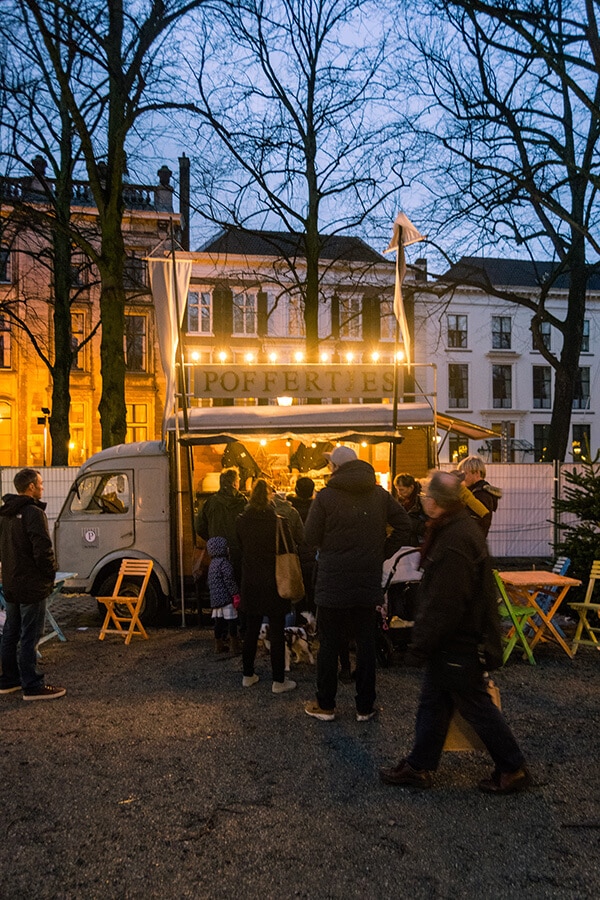 Poffertjes stall at the Royal Christmas Market in the Hague, the main Christmas market in the Hague! This Dutch Christmas market is on one of the most beautiful streets of the Hague. #travel #kerst #holland #christmas