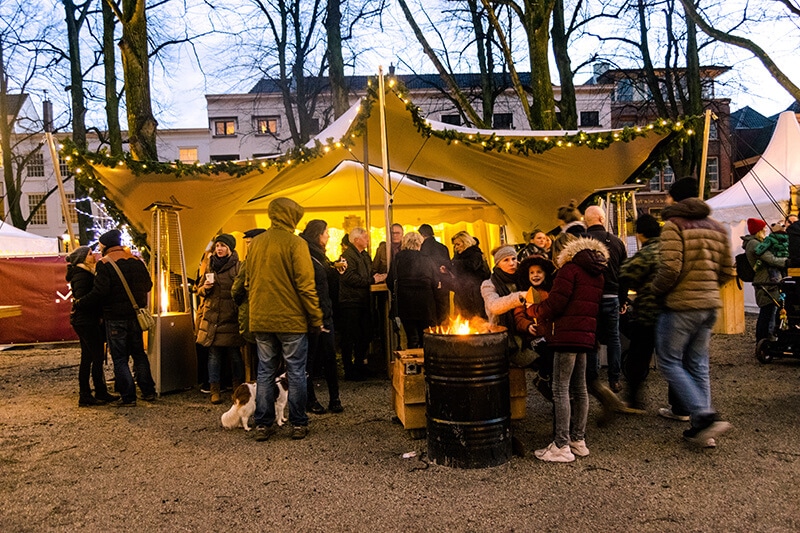 Revellers enjoying the Royal Christmas Market in the Hague, one of the best Christmas markets in the Netherlands. #travel #holland #kerst