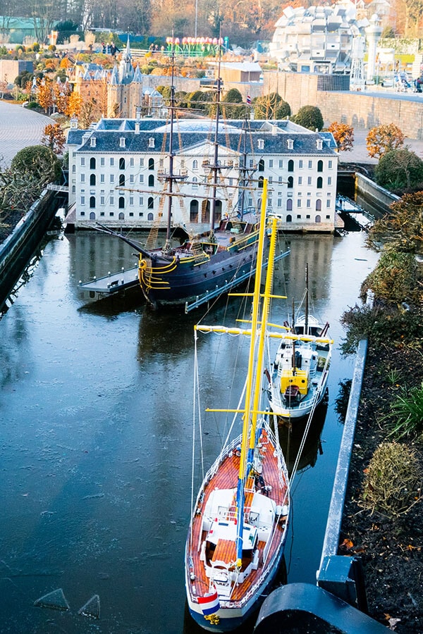 Beautiful scene of Amsterdam harbor from above at the Madurodam.  Read why you should visit this miniature theme park in the Hague! #travel #holland #netherlands #amsterdam