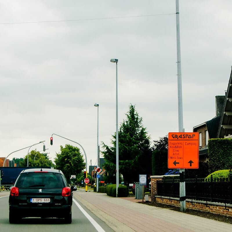 Sign in Dessel, Belgium showing the way to Graspop Metal Meeting