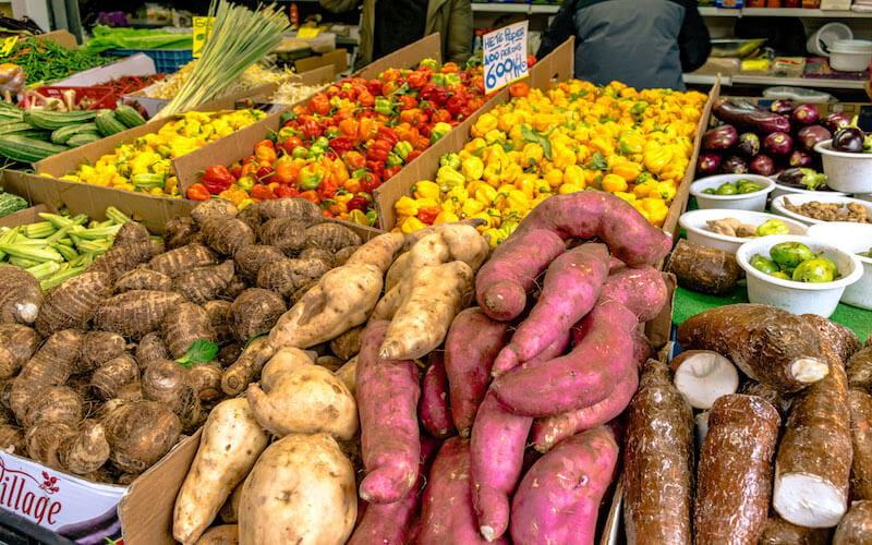 Colorful Surinamese vegetables at the Haagse Markt (Hague Market), a fun market to browse during your visit to the Hague.  This market is full of interesting produce. #travel #hague