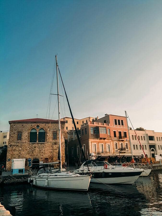 Beautiful golden hour with ships near port of Chania, Crete.  One of the highlights of any Crete itinerary! 