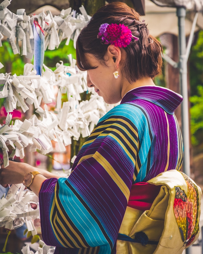 Photo of girl at shrine in Kyoto. Read more tips for visiting Kyoto with tips for the most beautiful temples in Kyoto to visit. #japan #travel #asia