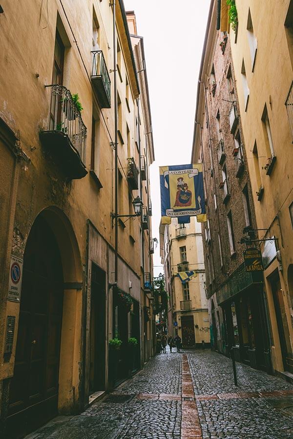 Charming side street of Quadrilatero, one of the cutest neighborhoods of Turin.  Exploring this neighborhood needs to be on your list of the best things to do in Turin!